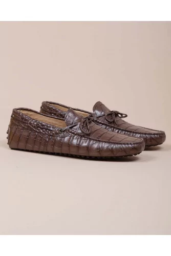 Brown moccasins with crocodile print