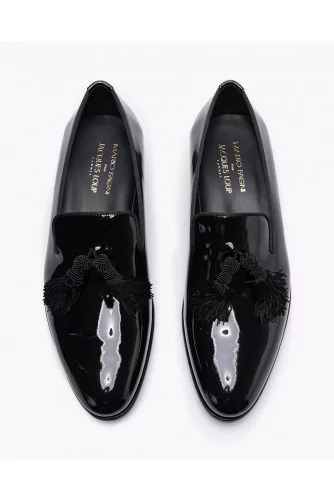 Varnished leather slip-ons with tassels