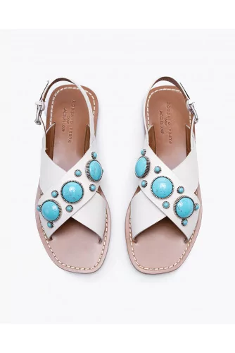 Flat leather sandals decorated with cabochons