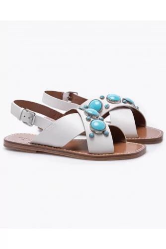 Flat leather sandals decorated with cabochons