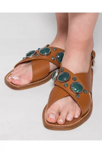 Flat leather sandals decorated with cabochons