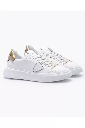 Leather sneakers with escutcheon and buttress