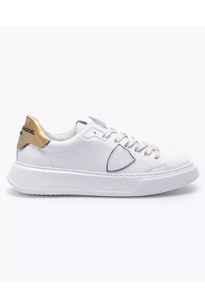 Leather sneakers with escutcheon and buttress