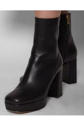 High-heeled leather boots with lightly square-shaped toe 70