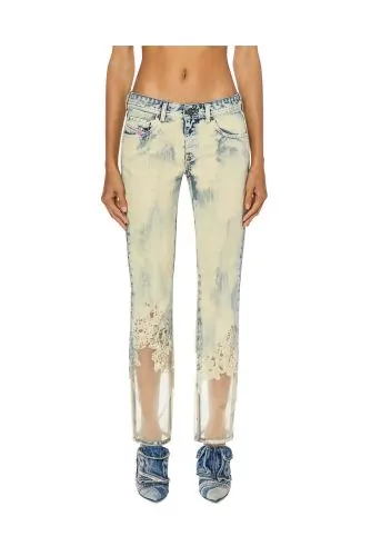 Jean taille basse en denim dévoré dans le bas
