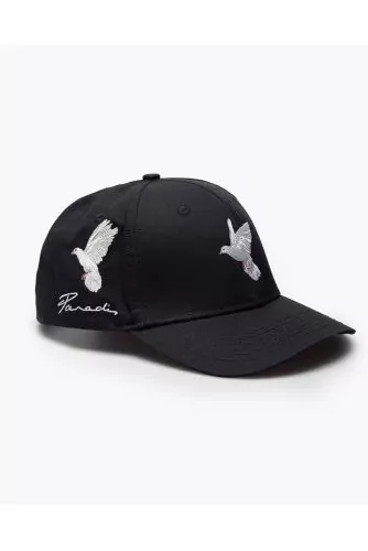 Cotton cap with applied flying doves