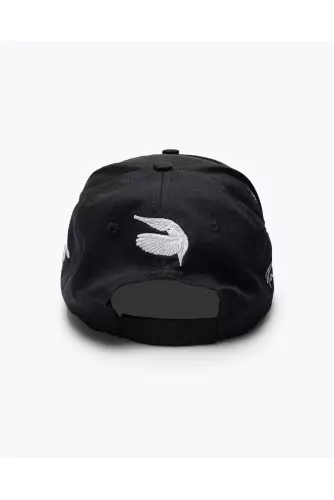 Cotton cap with applied flying doves