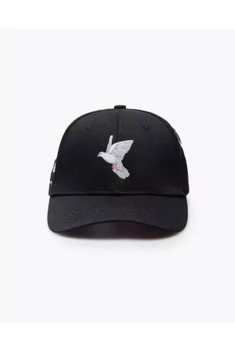 Cotton cap with applied flying doves