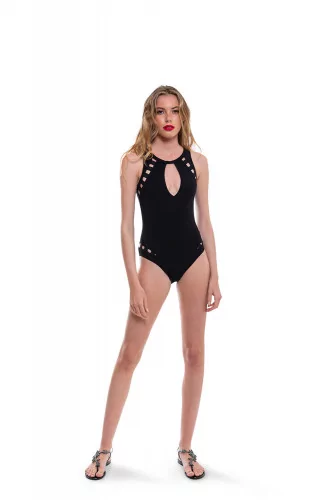 Swimsuit with open back and decorative perforations