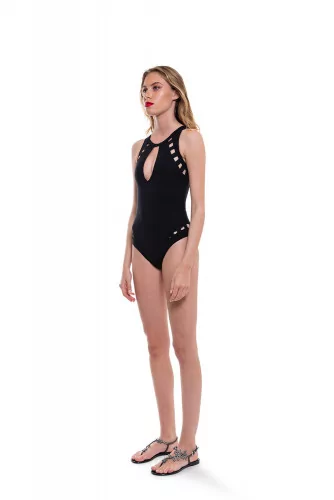 Swimsuit with open back and decorative perforations