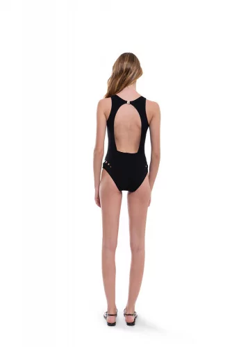 Swimsuit with open back and decorative perforations