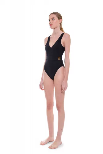 Bathing suit with draped belt and logo closing